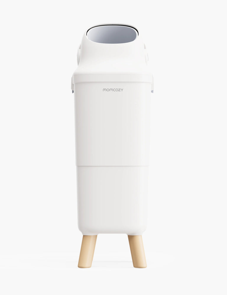 Translation missing: en.A white tall bin named momcozy is in the center with four beige legs and an opening on top, the background is white